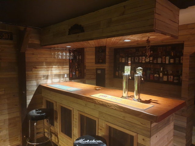 Bluegum Timber Slab used for this bar top and pool room lined with timber throughout. Timbers available from Tradeware Building Supplies Brisbane