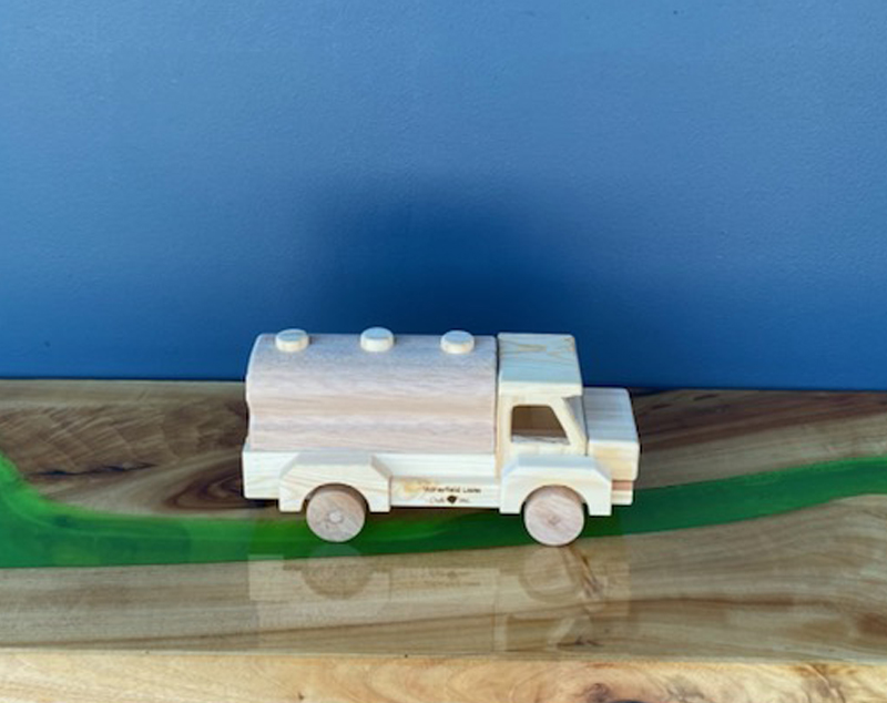 Wooden toy trucks and cars available from Tradeware Building Supplies, Chandler
